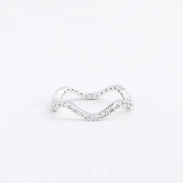 Luxurious silver jewelry ring with transparent crystals, rhinestones drops, on a grey background — Stock Photo, Image