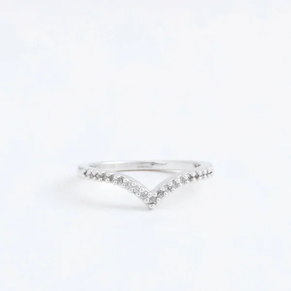 Luxurious silver jewelry ring with transparent crystals, rhinestones drops, on a grey background — Stock Photo, Image