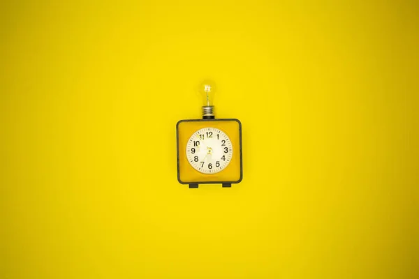Yellow Alarm Clock Light Bulb — Stock Photo, Image