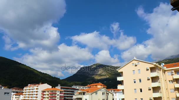 Clouds over the town and mountains — Stock Video