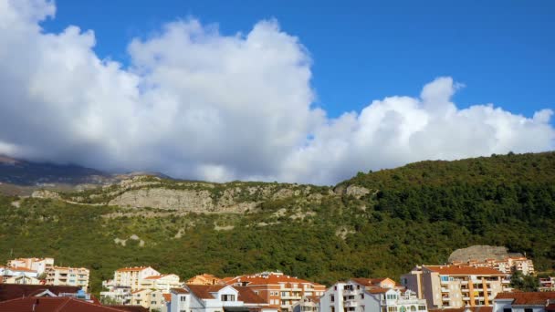 Clouds over the town and mountains — Stock Video