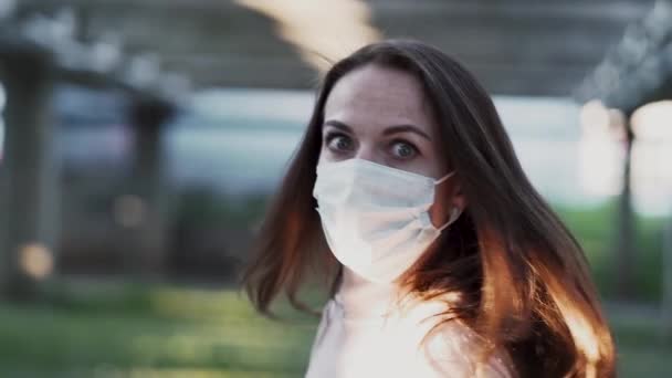 Girl in protective mask and rubber gloves depicts horror and fear — Stock Video