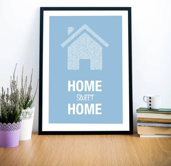 Frame on desk with Home Sweet Home quote — Stock Photo, Image