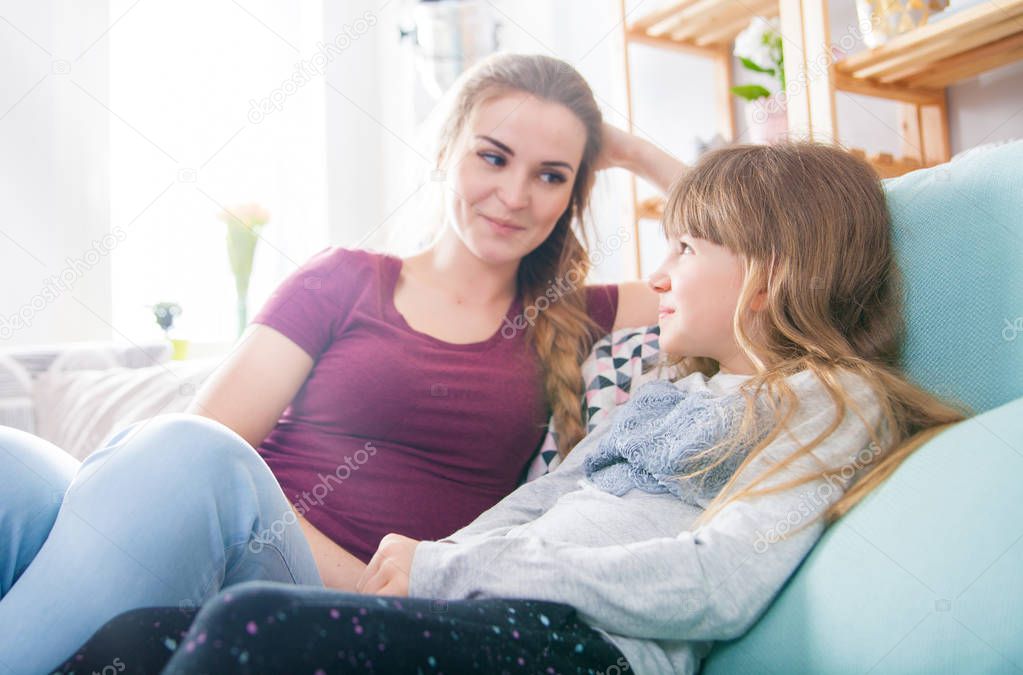 Mother and daughter at home, happy loving family