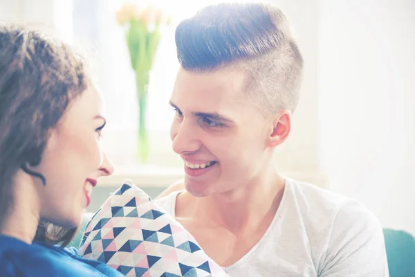 Loving couple looking at each other and talking home interior — Stock Photo, Image