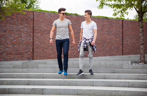 Two friends casual wear walking in town and laughing, best friend — Stock Photo, Image