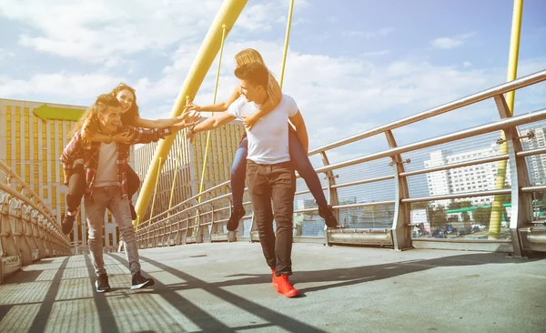 Two couples friends having fun and walking in the city — Stock Photo, Image