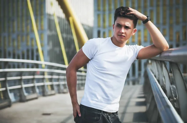 Handsome young man on walk in city — Stock Photo, Image