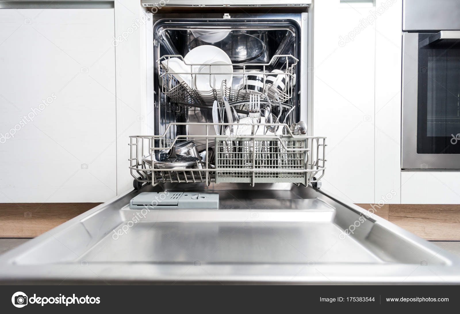 Clean dishes and accessories in dishwasher after washing Stock