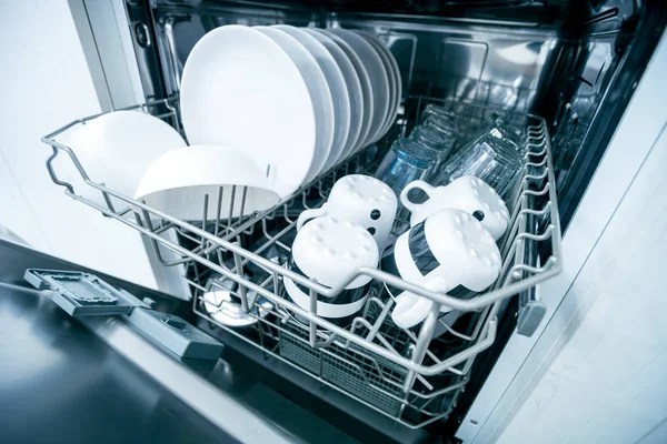 Open dishwasher with clean dishes close up — Stock Photo, Image