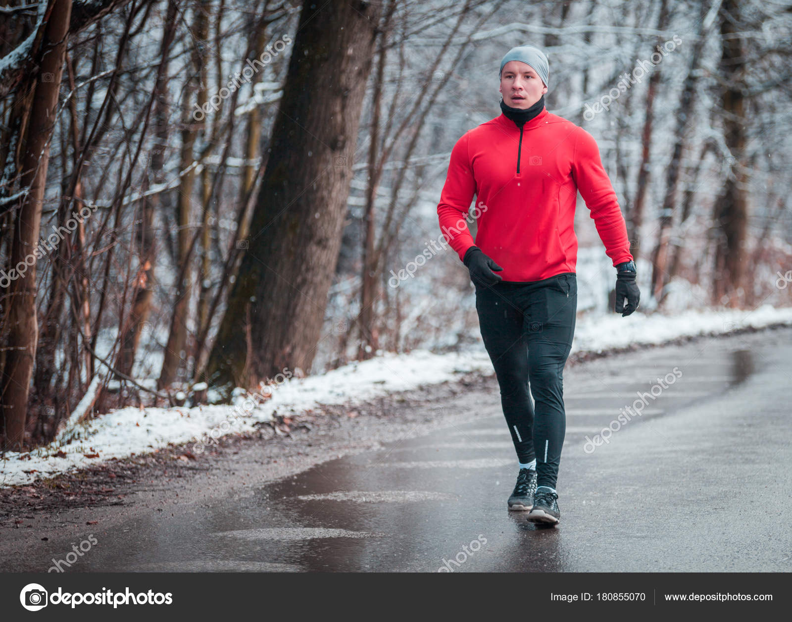 Athlete wearing warm sporty running clothes, winter exercise outdoor Stock  Photo by ©leszekglasner 180855070
