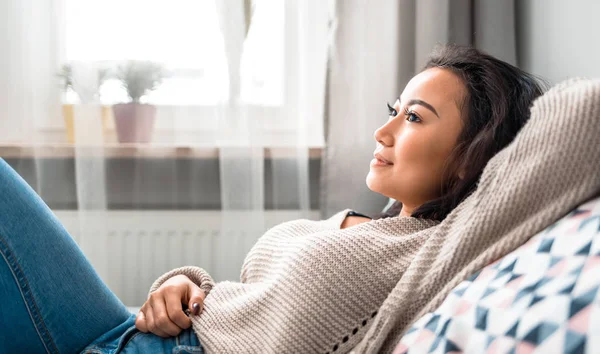 Asian girl at home deep in thoughts thinking and planning — Stock Photo, Image