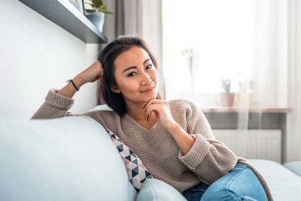 Asian girl at home deep in thoughts thinking and planning — Stock Photo, Image