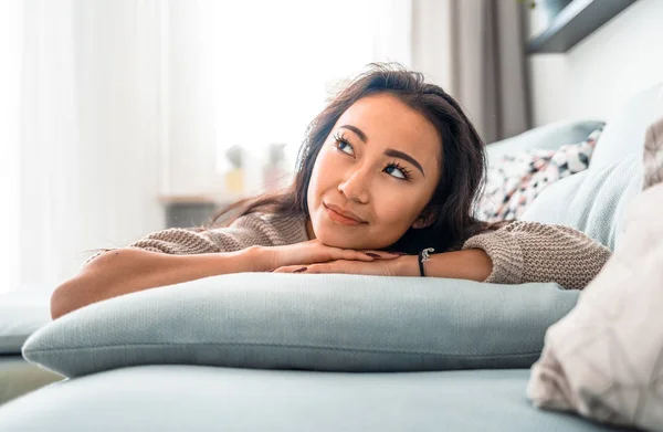 Asian girl at home deep in thoughts thinking and planning — Stock Photo, Image