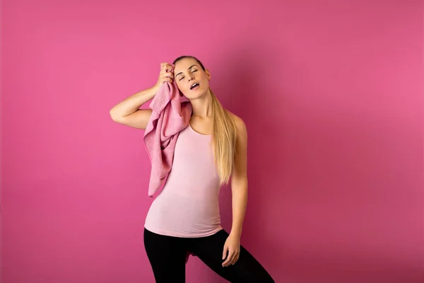 Young Fit Woman Tired Workout Towel Her Shoulders Pink Background — Stock Photo, Image