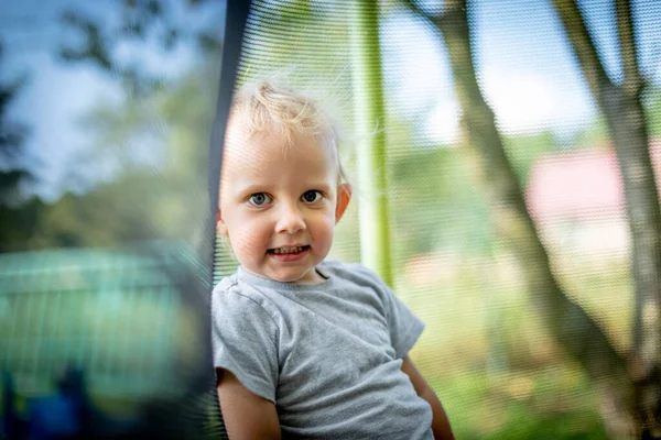 Little Child Playing Jumping Trampoline Outdoor Backyard — Stock Photo, Image