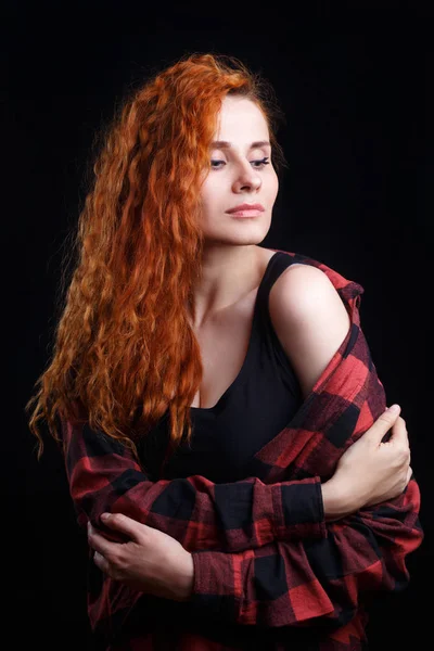 Young attractive doubting stressed woman with red curly hair iso