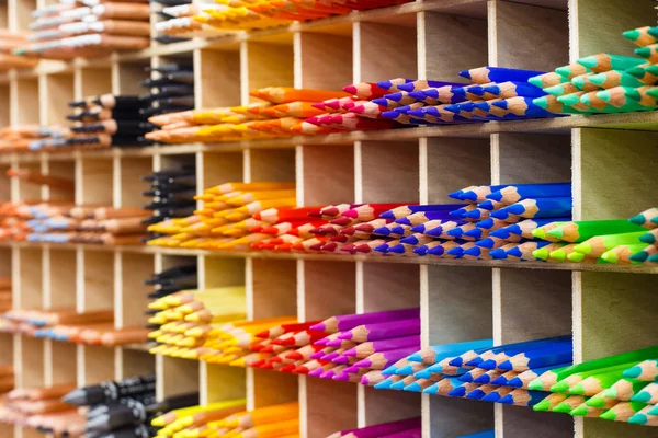 Multicolored pencils in art store closeup