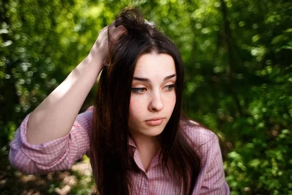 Portrait of attractive young hesitant perplexed woman  face clos