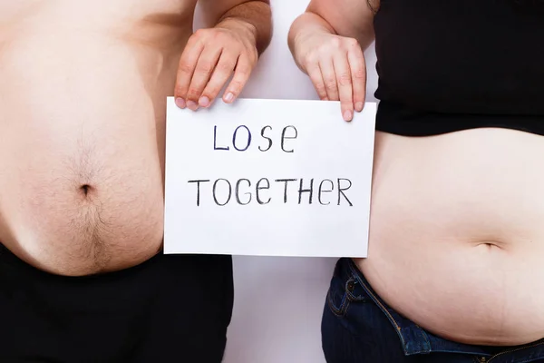 Man and woman,overweight couple standing close — Stock Photo, Image