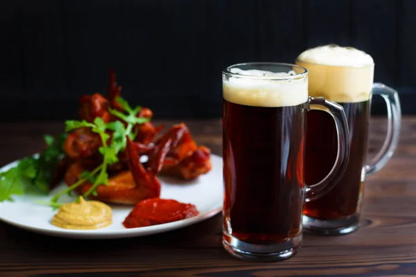 Beer snacks, pub, kitchen background, restaurant menu. Two mugs — Stock Photo, Image