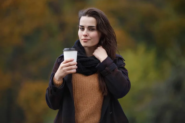 Young woman wearing  stylish checkered coat and knitted sweater — Stock Photo, Image