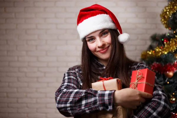 Portrait of young beautiful happy woman in Santa cap with severa — Stock Photo, Image