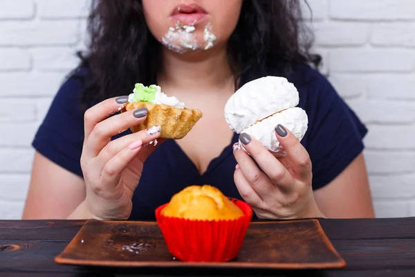 Food addiction, dieting concept. Young overweight woman fed up w