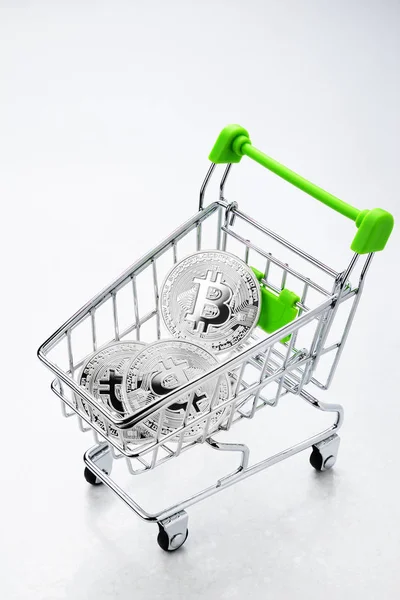 Bitcoin in the shopping cart — Stock Photo, Image