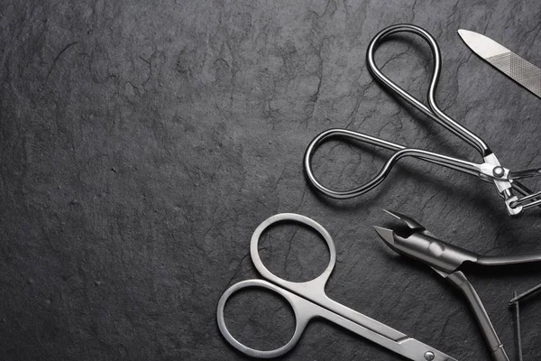 Manicure and pedicure tools set on black background — Stock Photo, Image