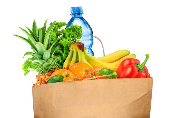 Grocery bag with fruits and vegetables isolated on white background