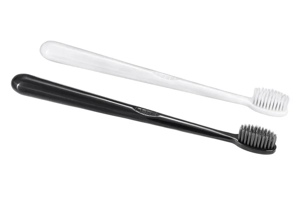 2つのシンプルな古典的な黒と白の歯ブラシを隔離 — ストック写真