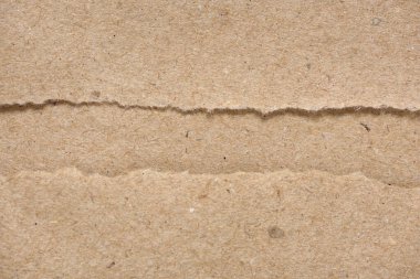 Kahverengi el işi kağıt dokusunu ya da arka planını yırtmış. Üst Manzara. Boşluğu kopyala