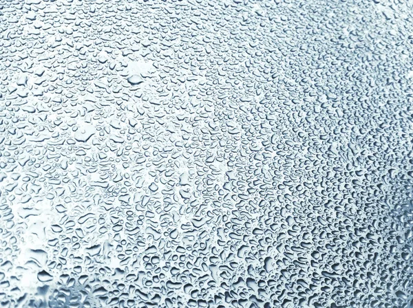Капли воды на поверхности — стоковое фото