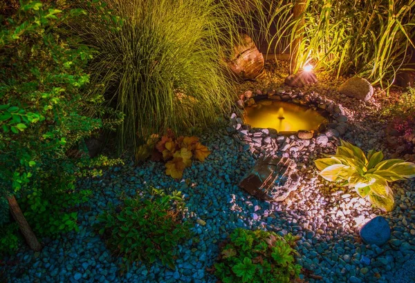 Illuminated Garden with Pond — Stock Photo, Image