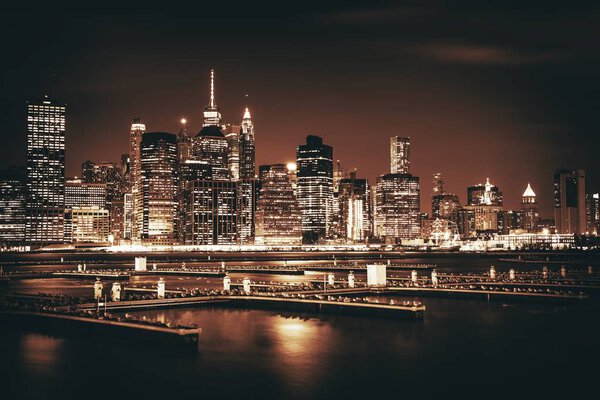 Manhattan Island New York City Skyline at Night in Sepia Color Grading. NYC, United States of America.