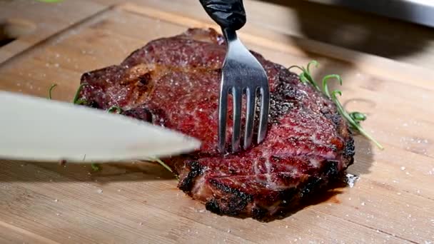Slicing Fresh Cooked Tom Hawk Steak Closeup Video — Stock Video