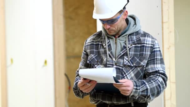 Construction Supervisor Inspects Job Site Signs Paperwork Completed Projects — Stock Video