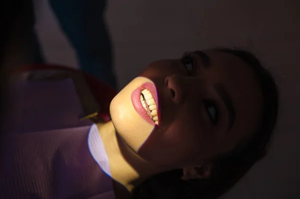 Beautiful smile in the dentistry, isolated by light.