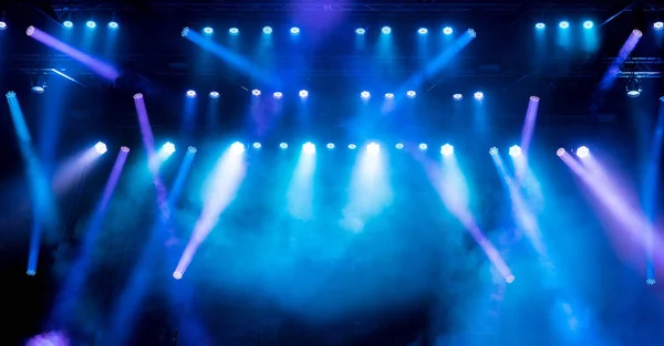 Stage light with colored spotlights and smoke. — Stock Photo, Image