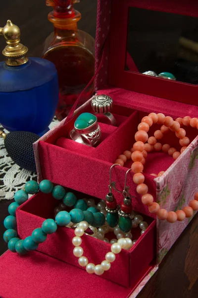 Jewels box with necklaces, earrings, bracelet, rings and perfume