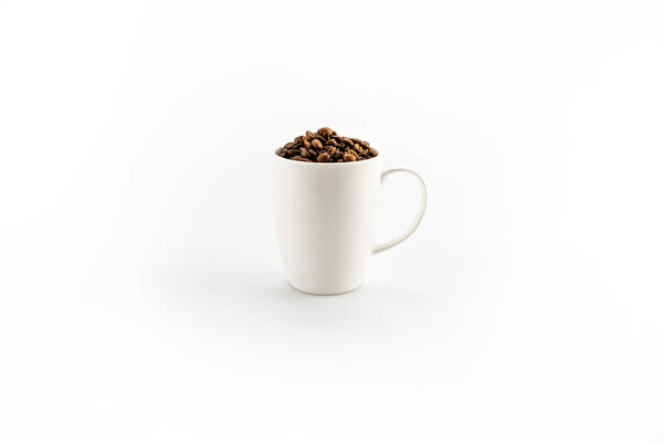 coffee beans in coffee mug