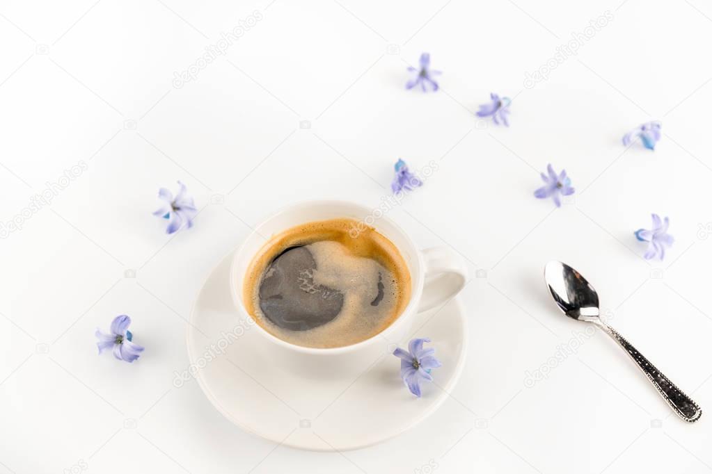 Cup of coffee and flowers 