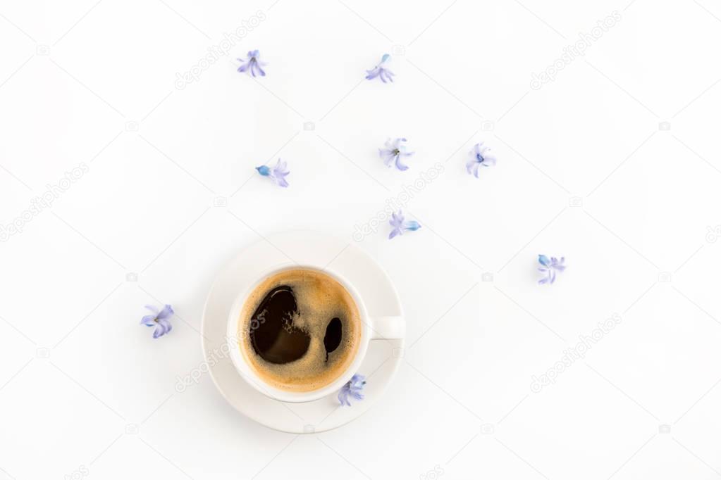 Cup of coffee and flowers 