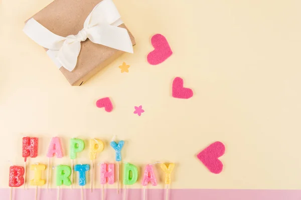 Happy birthday lettering and gift box — стоковое фото