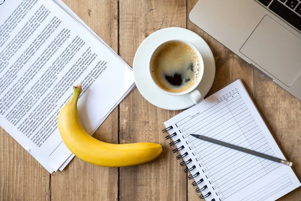 Ripe banana and laptop — Stock Photo, Image