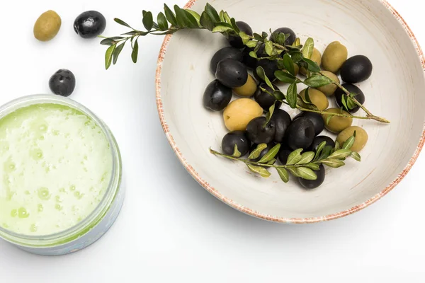 Organic cream and olives — Stock Photo, Image