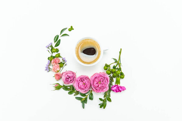 Beautiful flowers and cup of coffee