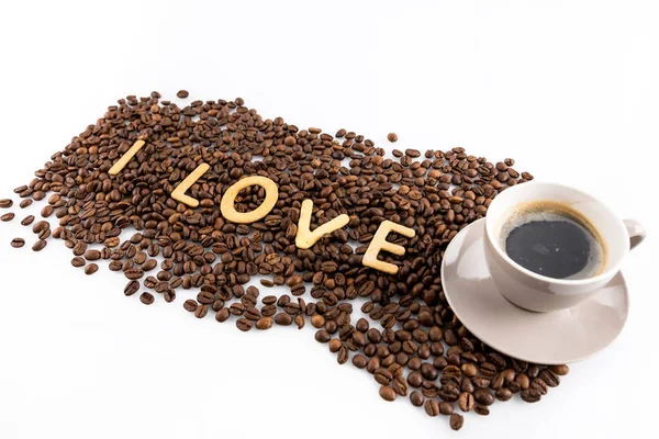 Cup of coffee and coffee beans — Stock Photo