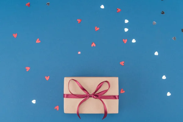 Gift box and confetti — Stock Photo